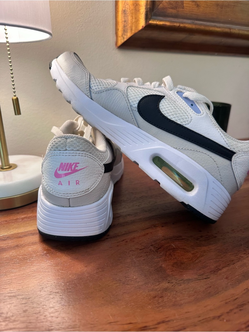 {Nike} Air Retro Trainer in White/Light Grey with Black Swoosh and Pink Logo